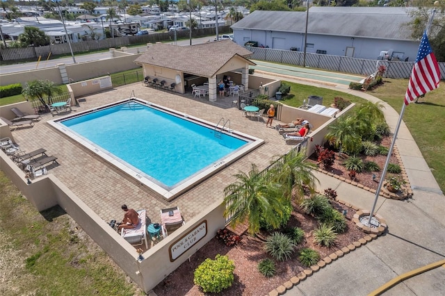 view of swimming pool with exterior bar and a patio area