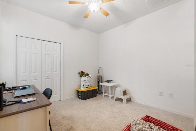 home office with ceiling fan and carpet floors