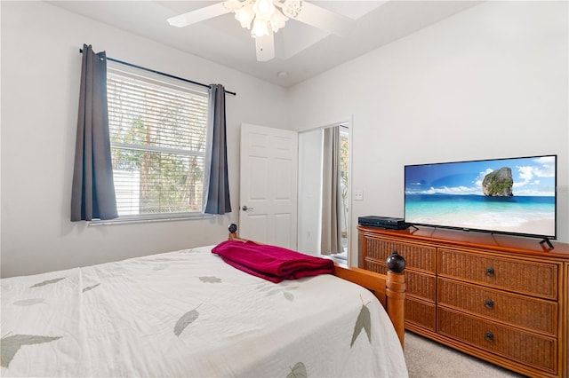 bedroom featuring light carpet and ceiling fan