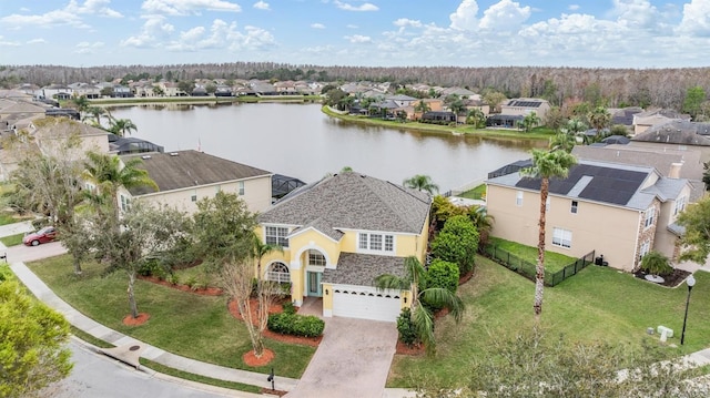 aerial view with a water view and a residential view