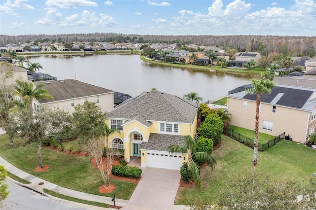 birds eye view of property featuring a residential view and a water view