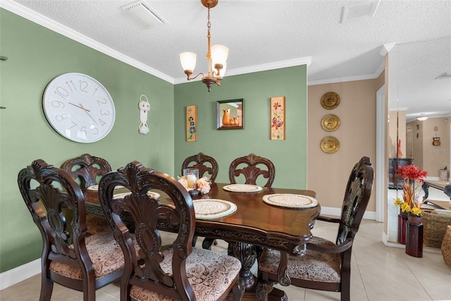 dining space featuring an inviting chandelier, light tile patterned floors, ornamental molding, and a textured ceiling