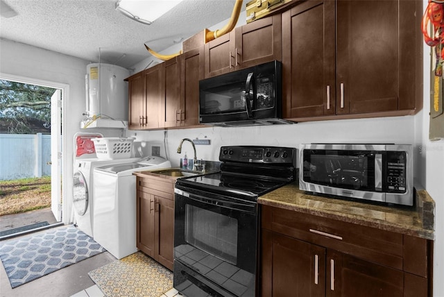 kitchen with water heater, sink, dark stone countertops, black appliances, and washer and clothes dryer