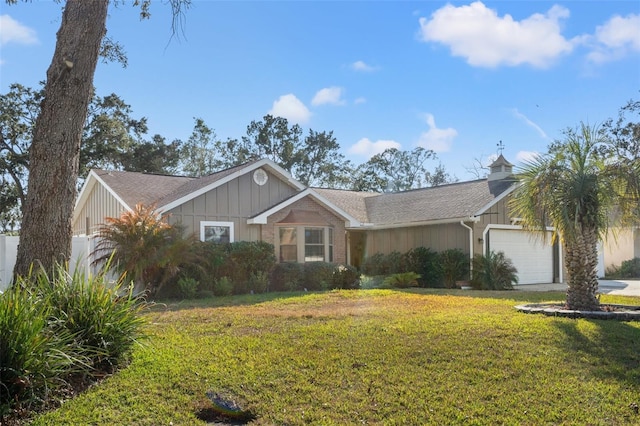 ranch-style home featuring a garage and a front lawn