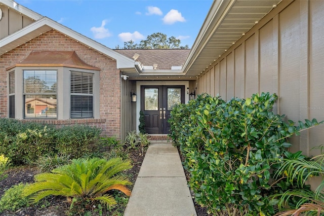 view of exterior entry featuring french doors