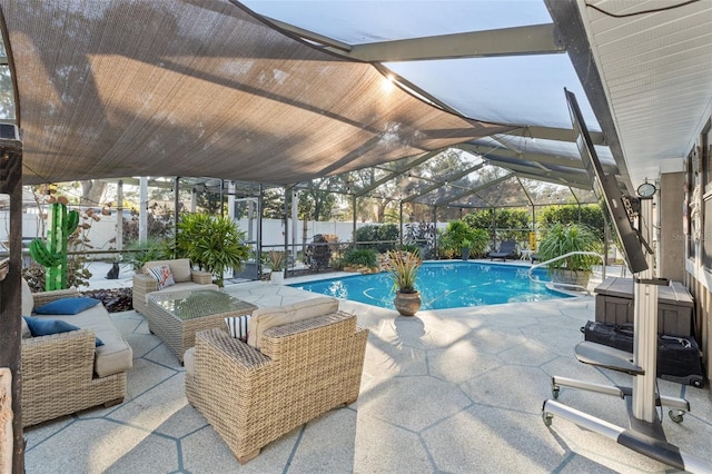 view of pool with a patio, outdoor lounge area, and glass enclosure