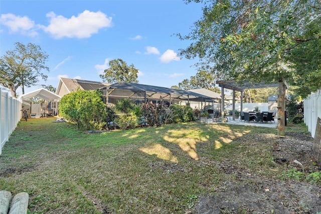 view of yard featuring a lanai, a pergola, and a patio