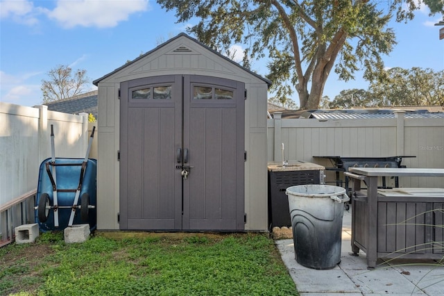 view of outdoor structure with a lawn