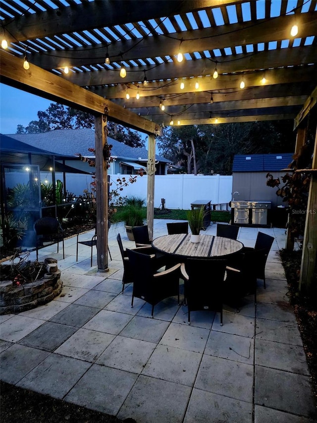 view of patio featuring a storage shed and a pergola