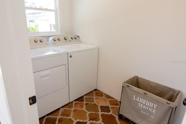 laundry area featuring washing machine and clothes dryer