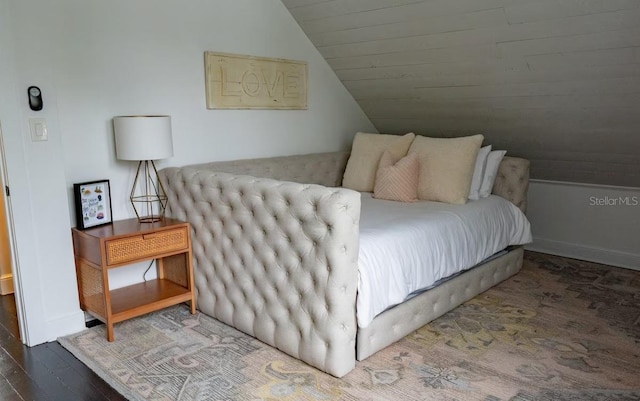 bedroom featuring wood-type flooring and lofted ceiling