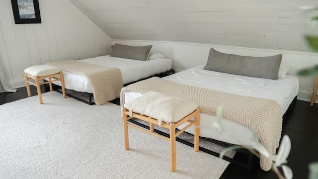 bedroom featuring vaulted ceiling