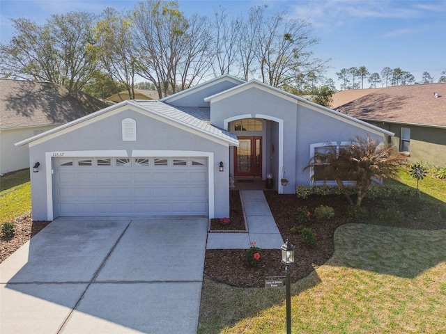 view of front of home featuring a garage and a front yard