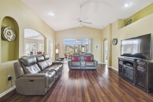 living room with vaulted ceiling, dark wood-type flooring, and ceiling fan