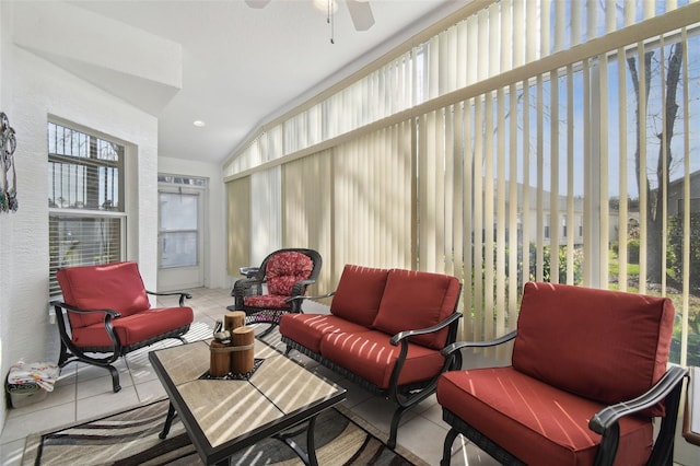 sunroom with lofted ceiling and ceiling fan