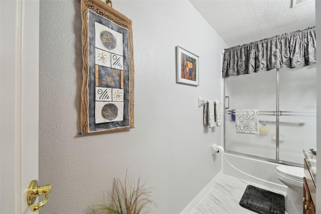 bathroom with toilet, combined bath / shower with glass door, and a textured ceiling