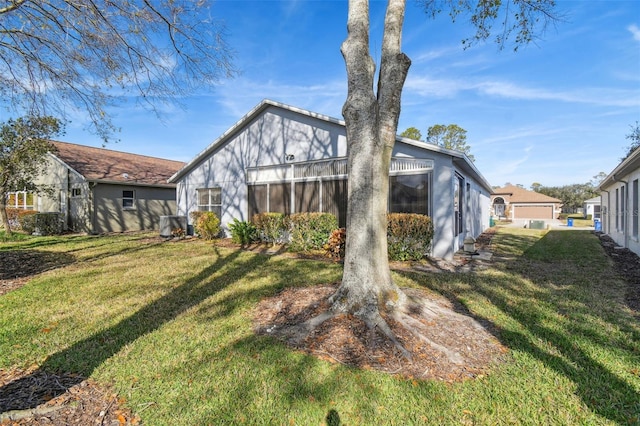 back of house featuring a yard