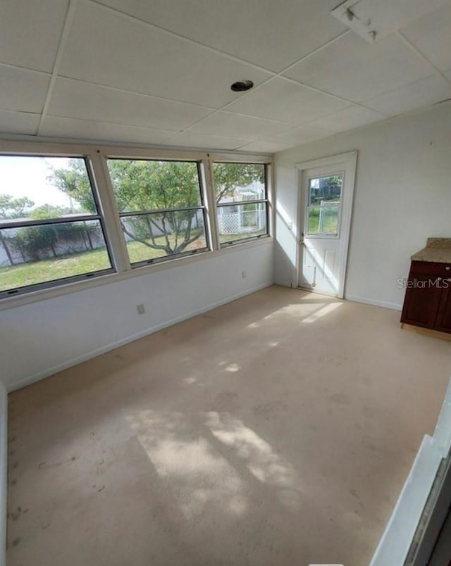 spare room with a paneled ceiling