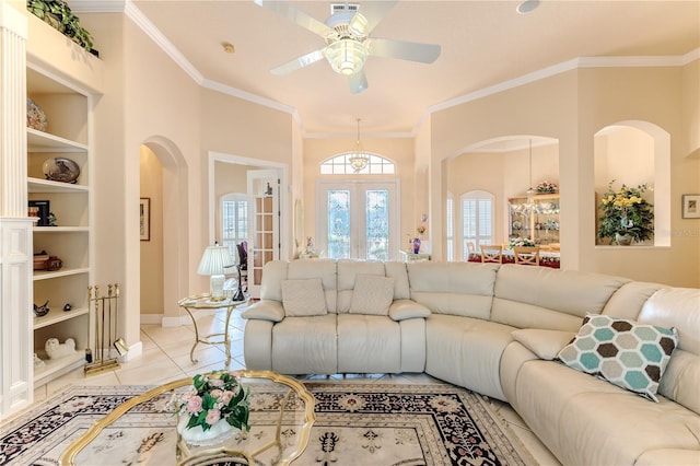 tiled living room featuring crown molding, ceiling fan, and built in features