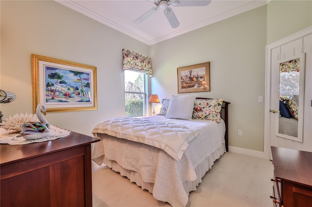 bedroom with crown molding, ceiling fan, and light carpet