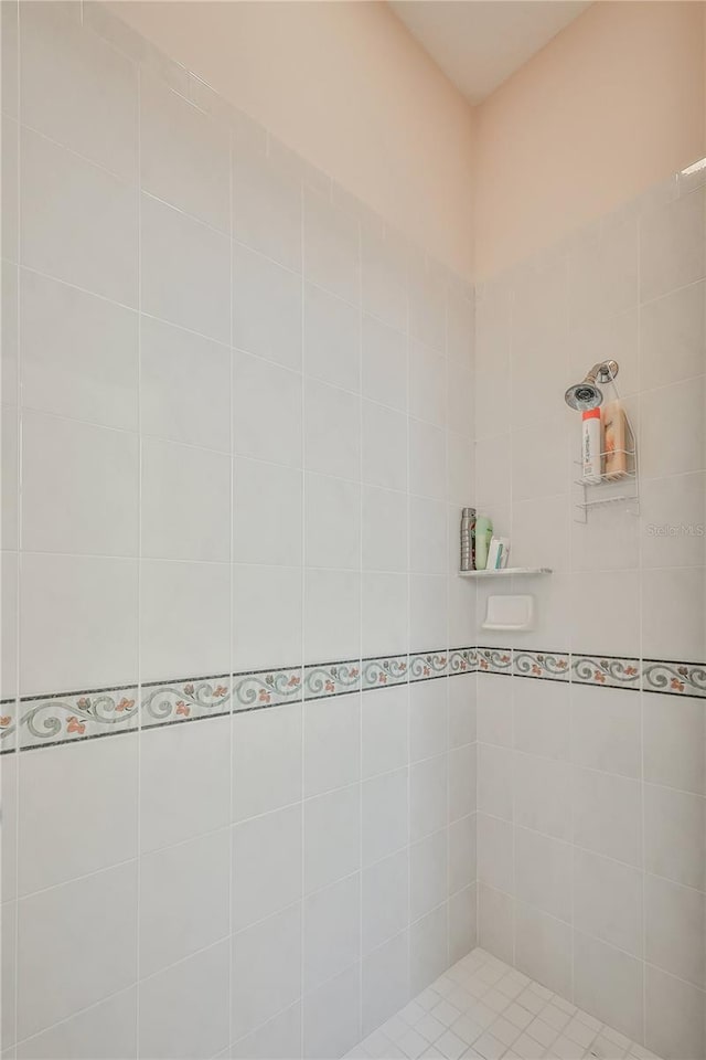 bathroom with a tile shower