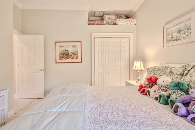 bedroom featuring ornamental molding and a closet