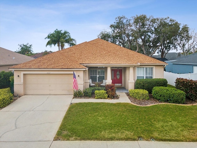 single story home with a garage and a front lawn