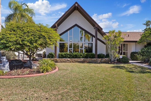 back of house featuring a yard