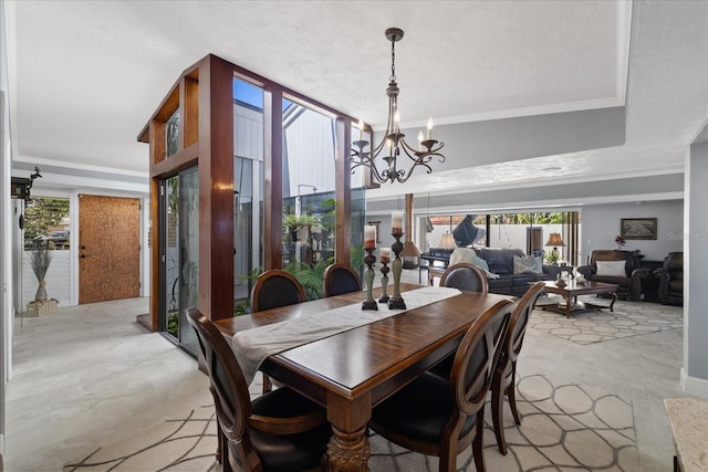 dining area featuring a notable chandelier and crown molding