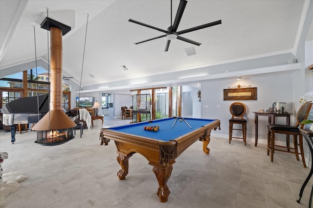 game room with lofted ceiling, billiards, ceiling fan, and a wood stove