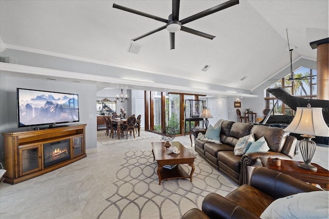 living room with lofted ceiling, ceiling fan with notable chandelier, and ornamental molding