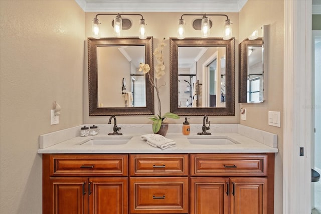 bathroom featuring ornamental molding and vanity