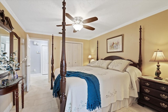 tiled bedroom featuring ceiling fan, ornamental molding, and a closet