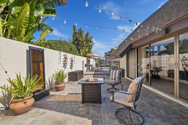 view of patio / terrace with an outdoor fire pit