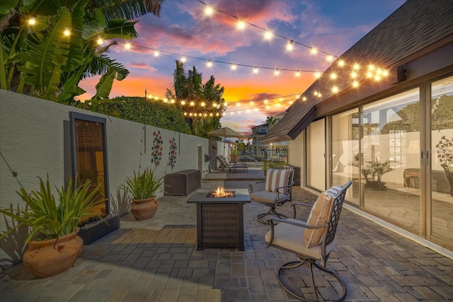 patio terrace at dusk with a fire pit