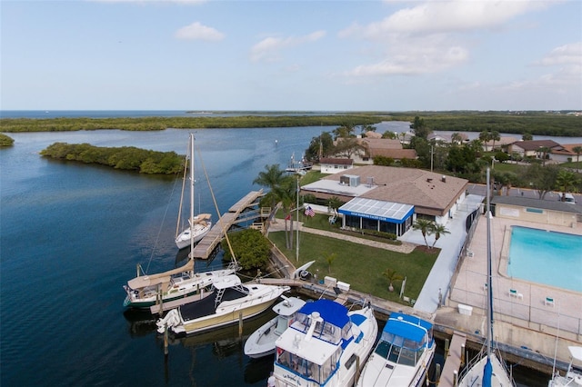 birds eye view of property with a water view