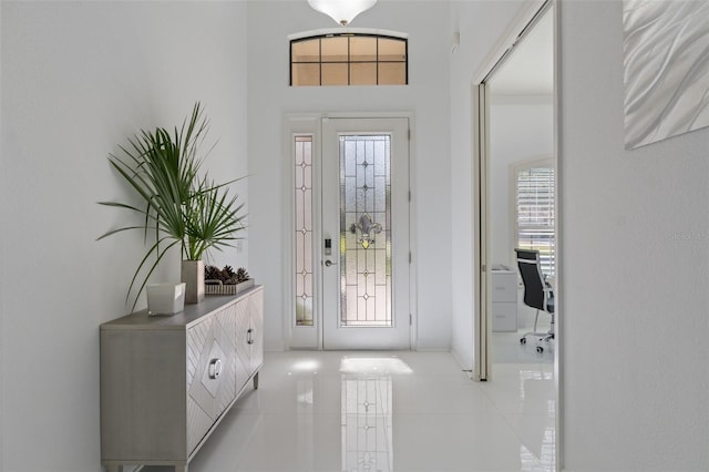 entrance foyer featuring light tile patterned flooring