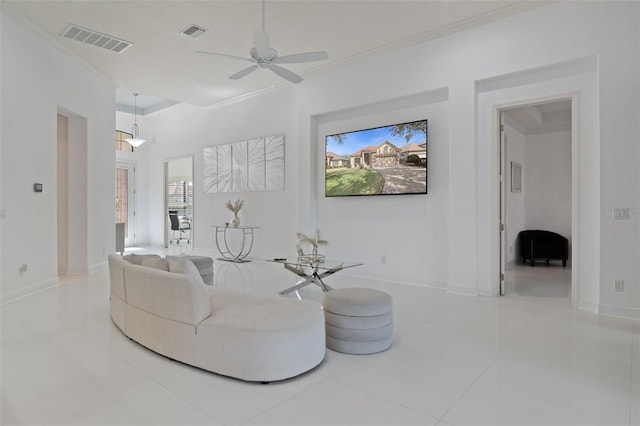 tiled living room featuring ornamental molding and ceiling fan