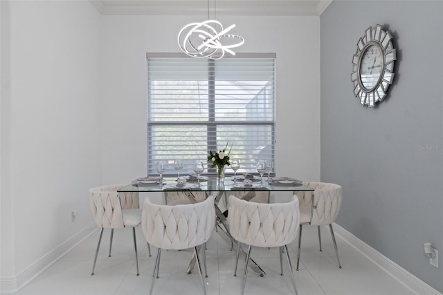 dining area featuring an inviting chandelier and ornamental molding