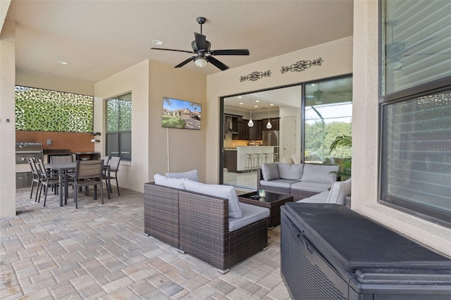 view of patio featuring ceiling fan, a grill, and an outdoor hangout area