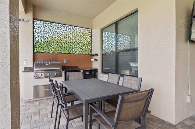 view of patio with exterior kitchen and grilling area