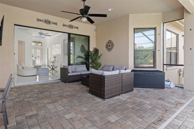 view of patio featuring an outdoor hangout area and ceiling fan