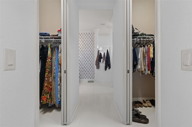 walk in closet featuring light tile patterned floors