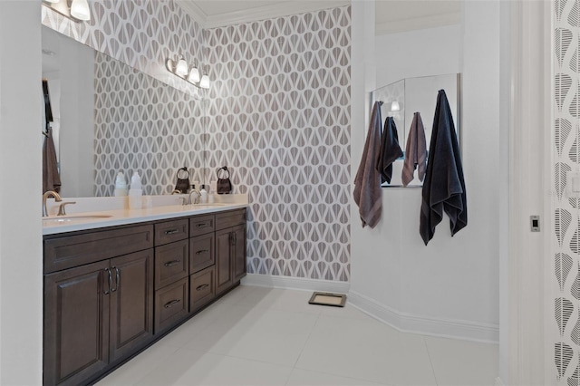 bathroom with crown molding, vanity, and tile patterned flooring