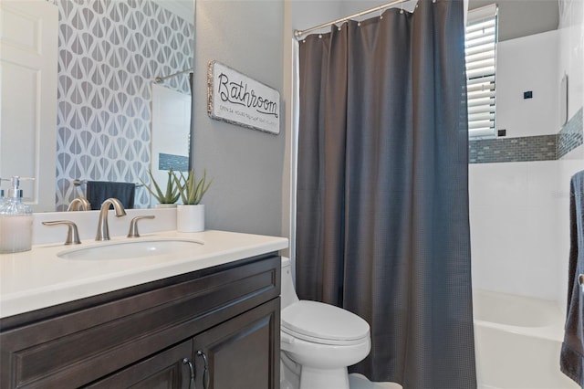 full bathroom featuring vanity, shower / bath combo, and toilet