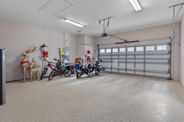 garage featuring a garage door opener and electric panel