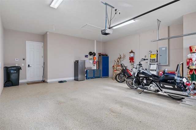 garage featuring a garage door opener and electric panel