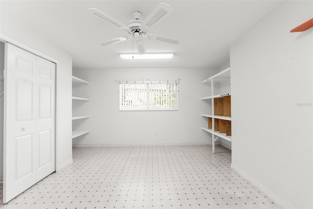 spacious closet with ceiling fan