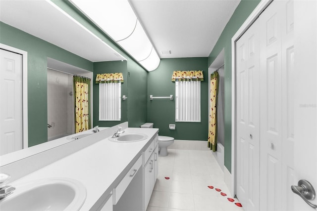 bathroom featuring vanity, curtained shower, tile patterned floors, and toilet