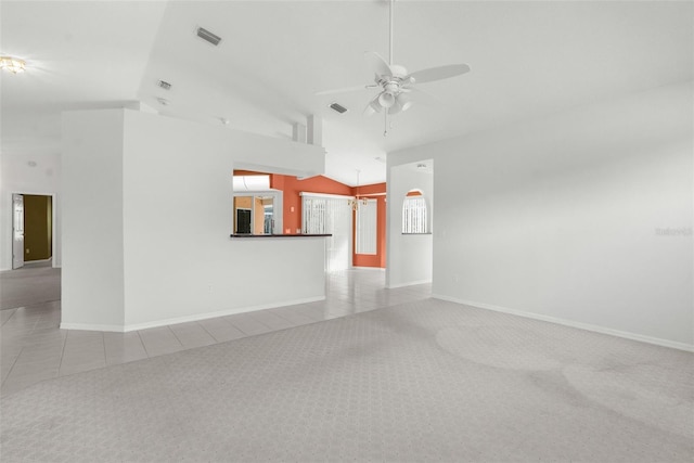 unfurnished living room featuring lofted ceiling, light colored carpet, and ceiling fan